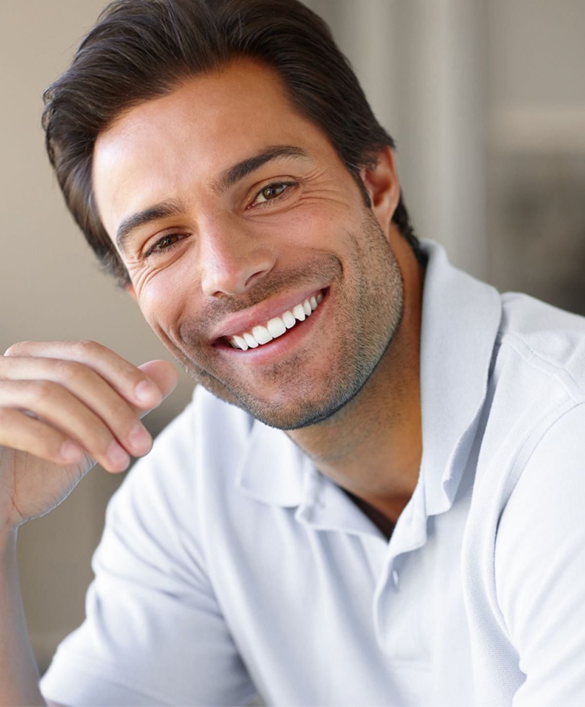 Smiling man in a casual polo shirt.