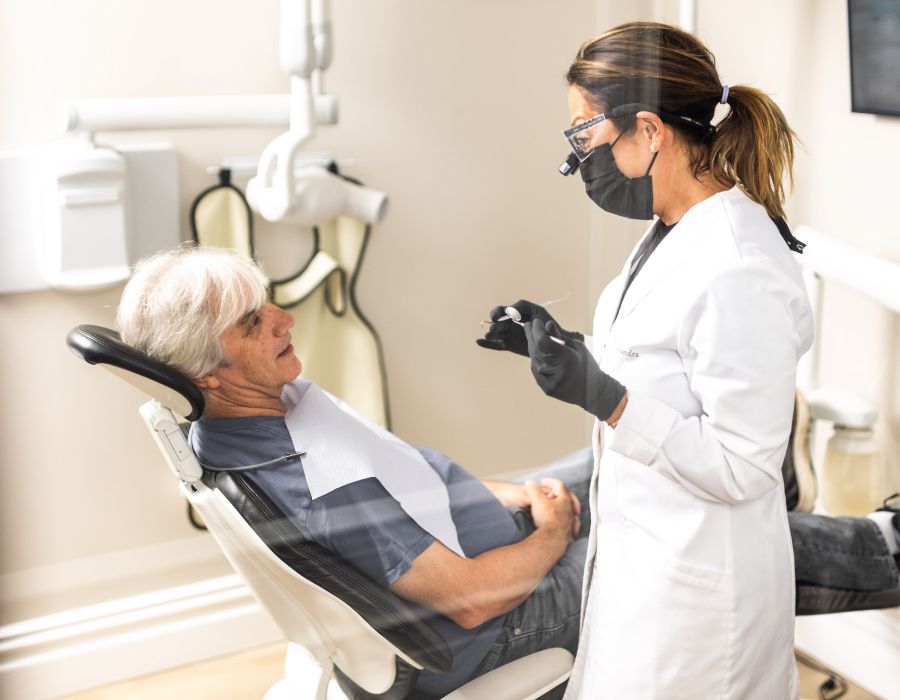 Dentist examining patient in dental office setting