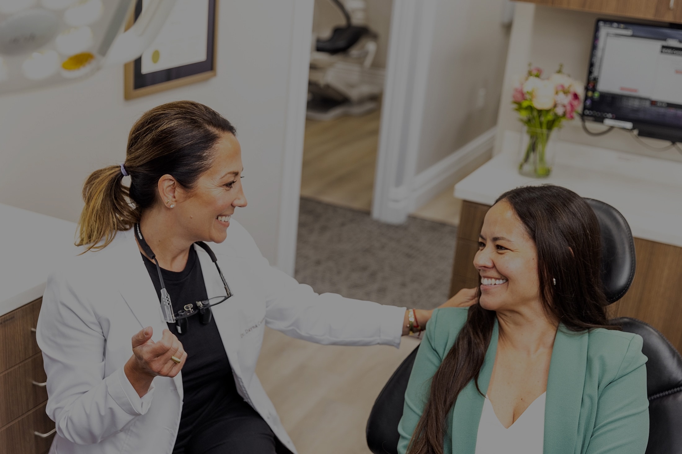 Cosmetic dentistry office hallway with welcoming sign.
